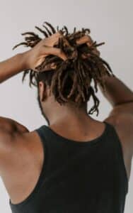 man massaging his scalp