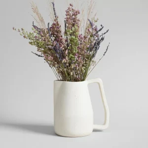 small handmade ceramic pitcher with lavender flowers