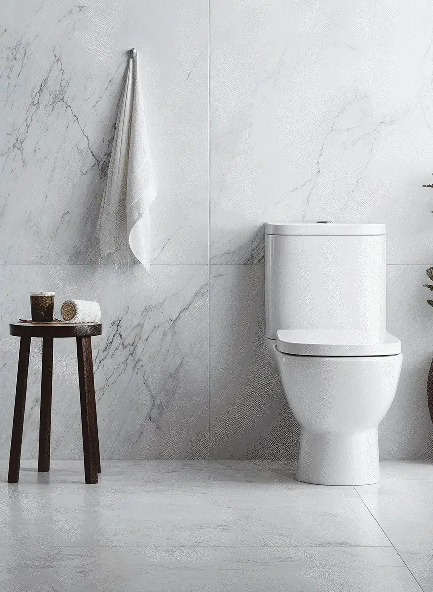 5 Eco Friendly Toilet Bowl Brushes: Transform Your Bathroom! 7 white bathroom, with clean cotton towel hanging on the towel rack and a wooden stool by toilet bowl