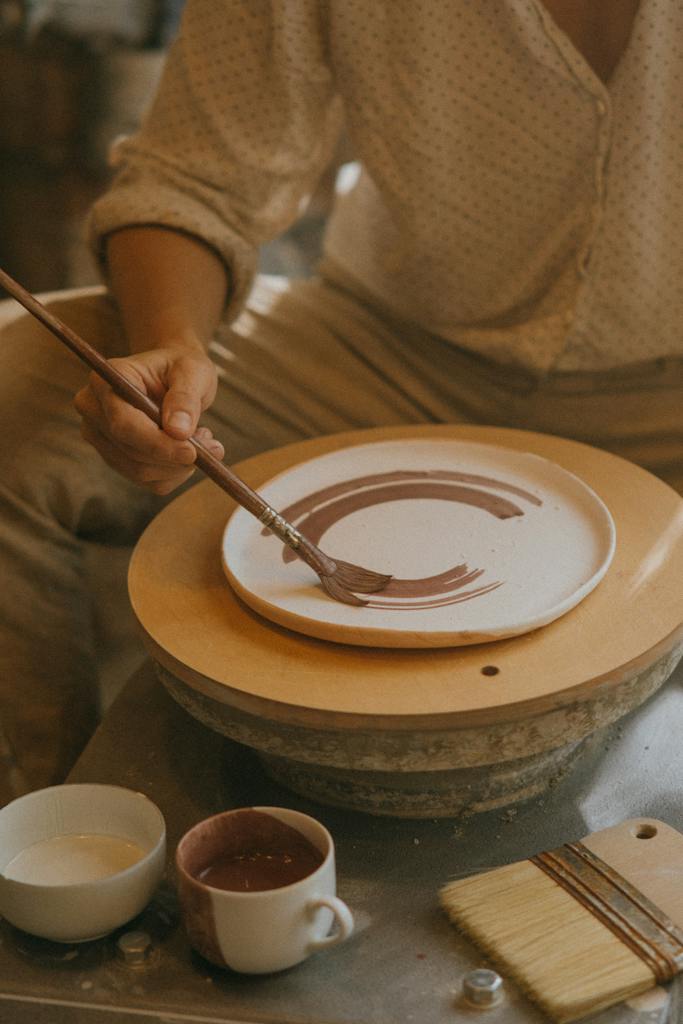 Craftsman doing Finishing Touches at non toxic Earthenware Plates