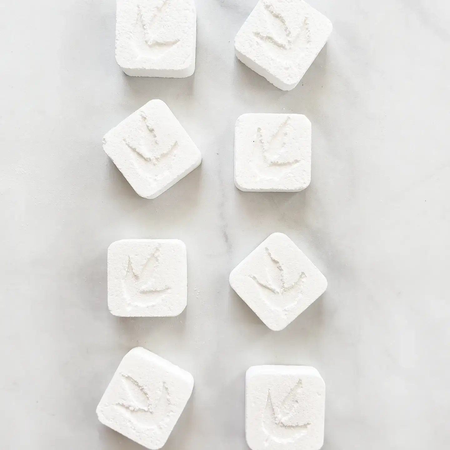 MamaSuds eco-friendly toilet cleaning bombs - 10 packs 4 Eight MamaSuds Toilet Bomb Cleaning Tabs arranged on a marble surface.