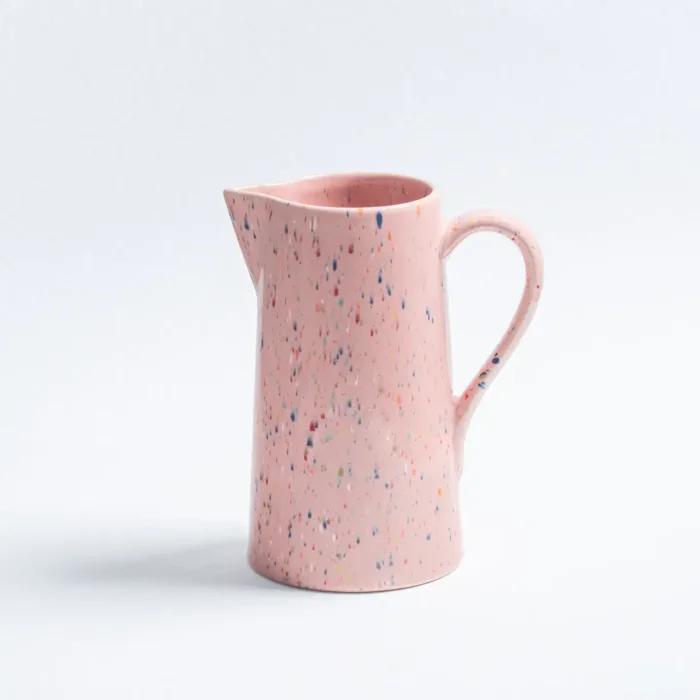 handmade ceramic pitcher with a speckled pink design, featuring a sturdy handle and a smooth pouring spout, ideal for everyday use as a functional and decorative ceramic pitcher.