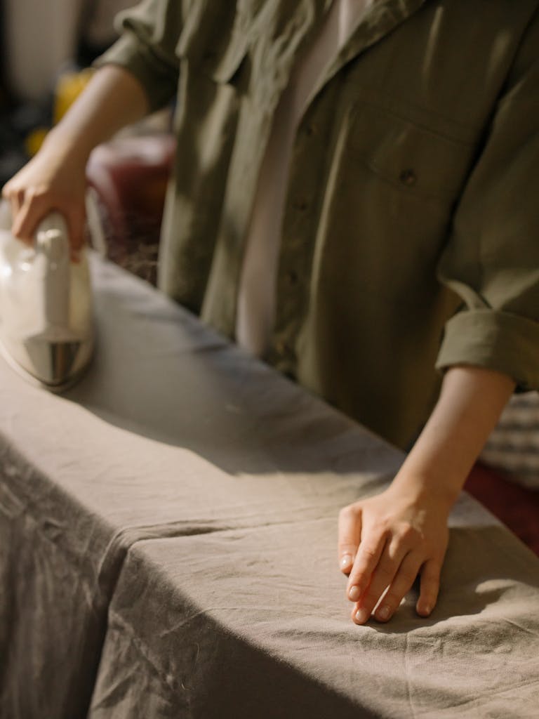 How To Care For Your Organic Cotton Duvet 7 Person in Brown Button Up Shirt Holding duvet cover