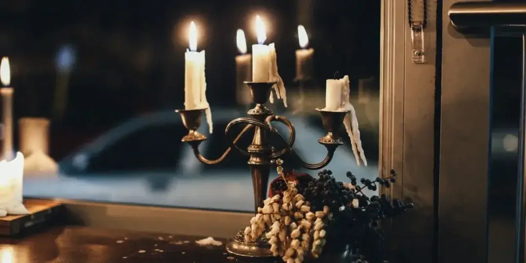 Candle Safety Tips for Your Home: Essential Guide for 2024 3 Candle Safety- candles on holder in front of a window