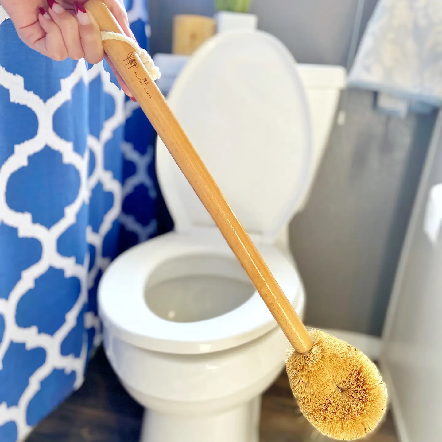 Natural Coconut Fiber Toilet Bowl Brush, Wood Handle Cleaning Brush for Bathroom Toilet 1 hand holding a Wood Handle Cleaning Brush for Bathroom Toilet