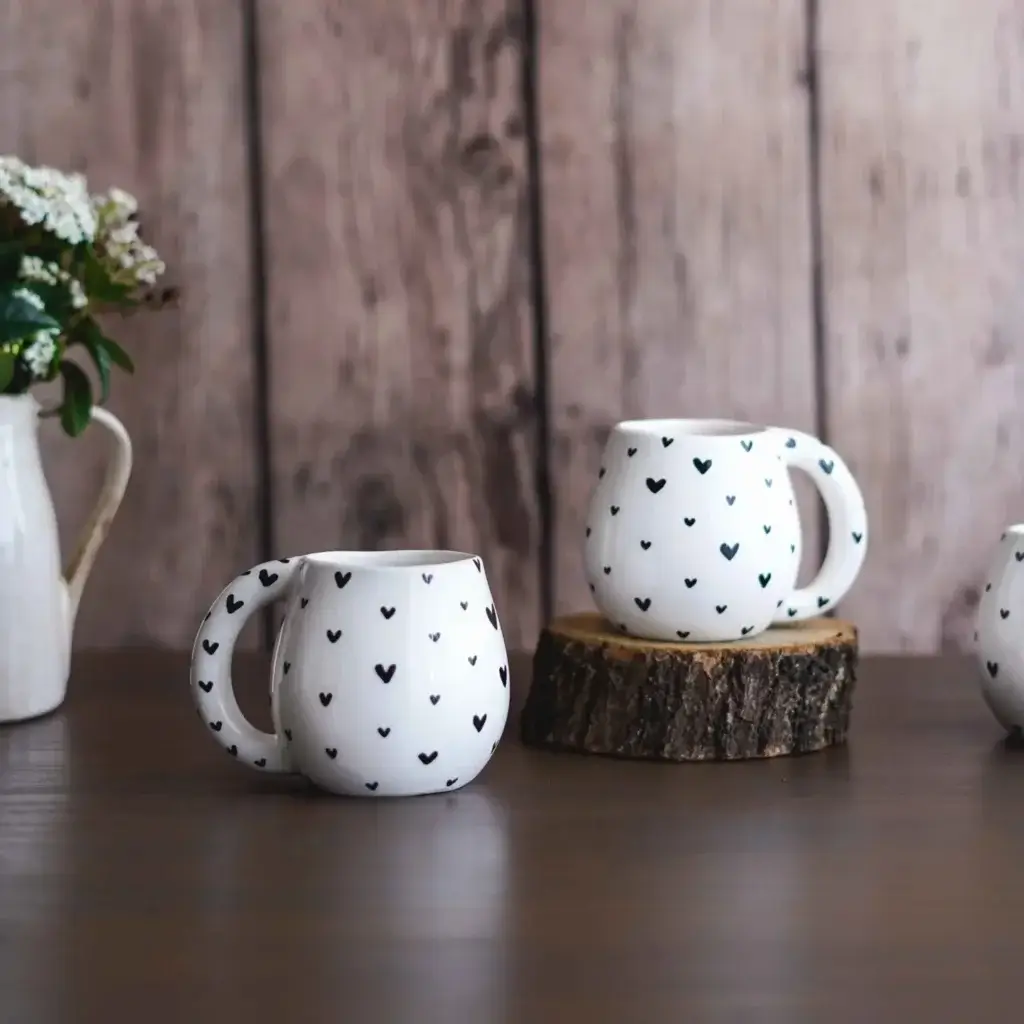 How to Care For Ceramic Tableware: A complete Guide (2024) 10 black hearts handmade ceramic mug on display