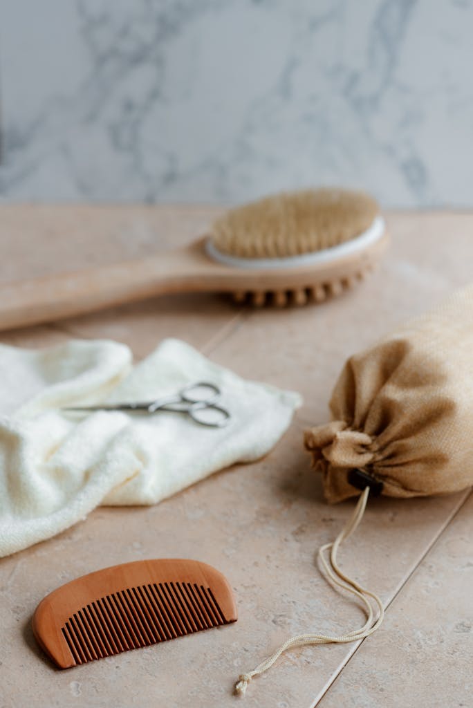 Natural Ways to Make Your House Smell Good Without Candles: A Comprehensive Guide 5 Eco friendly bath brush, DIY Scent Sachets and comb on table