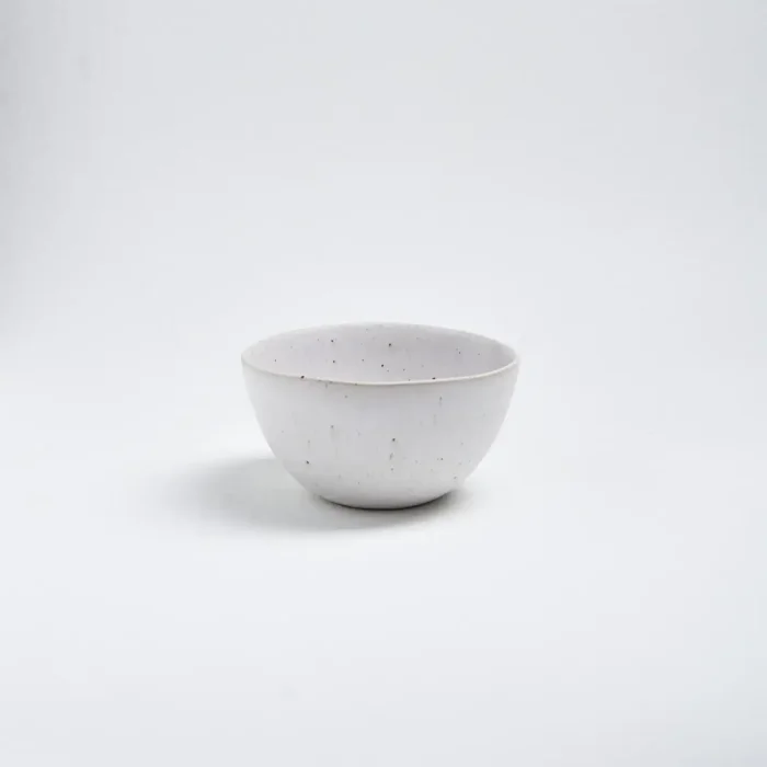 stoneware handmade ceramic bowl on white background