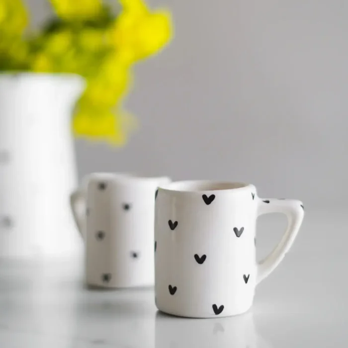 black and white handmade ceramic mug set on marble table