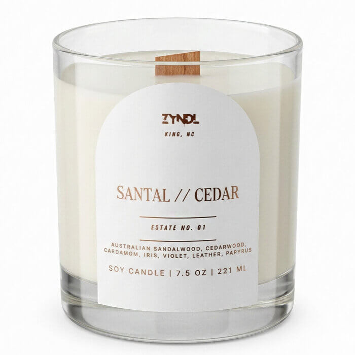 Cedar scented candle. Alt Text: Front view of the Estate No. 01 Santal // Cedar soy candle. The clean white label displays the premium fragrance notes of cardamom, papyrus, and cedarwood against a bright white background.