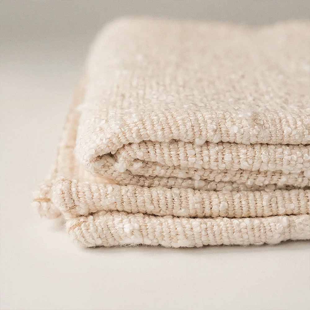 Boucle Throw Blanket | Boho Cotton Boucle Throw Blanket 2 Machine washable cotton boucle throw blanket in rust, folded to show soft texture and woven detail.