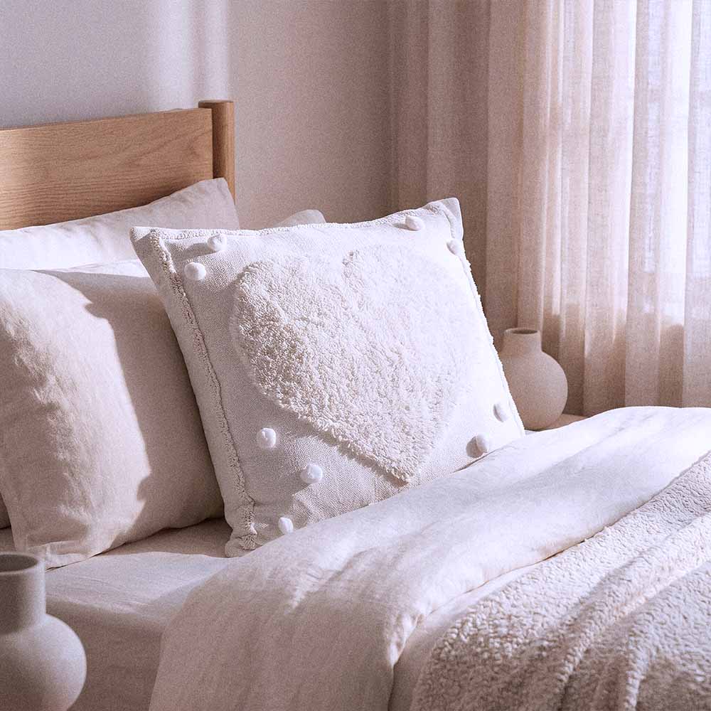 White Heart Tufted Pillow Cover | 18 x 18 Pillow Cover 3 Tufted pillow cover in white on linen bedding with cream euro shams for quiet luxury bedroom styling